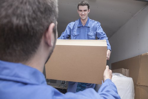 Removal team working in a South London street with moving van