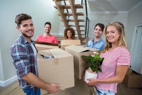 Professional house removalists loading furniture for a Southlondon home move