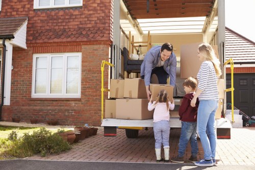 Moving boxes and furniture prepared for a South London removal