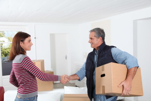 Local moving team carrying items through a Southlondon property entrance