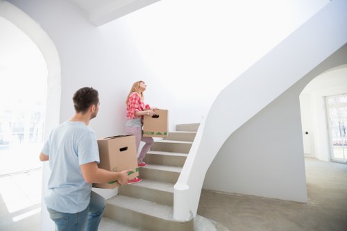 Professional removals staff handling household items with care