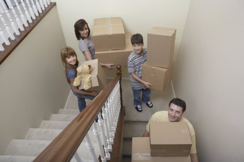 Helpers moving boxes and furniture for a customer in South London