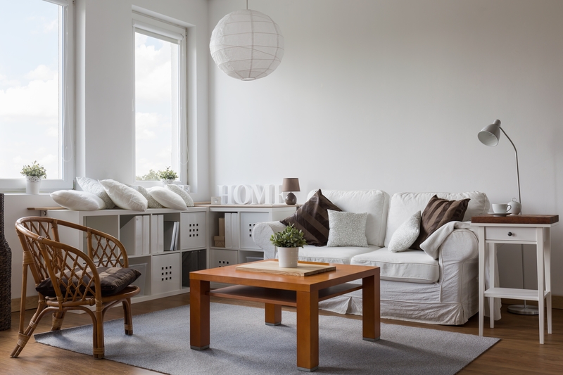 Removal team handling boxes and furniture in a Southlondon property